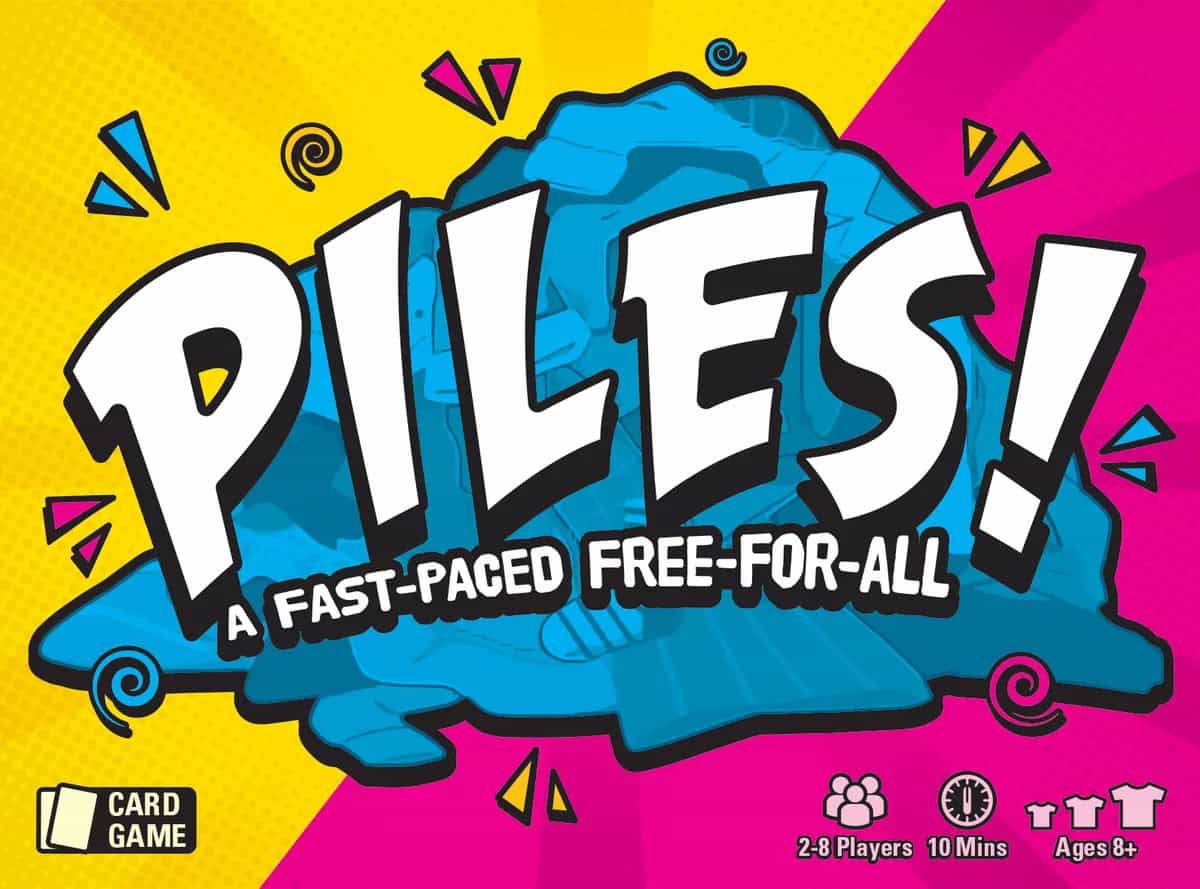 Piles!-korttipelin kannessa on kelta-magentalla taustalla hyvin abstrakti sininen vaateläjä ja päällä pelin nimi isoin kirjaimin.