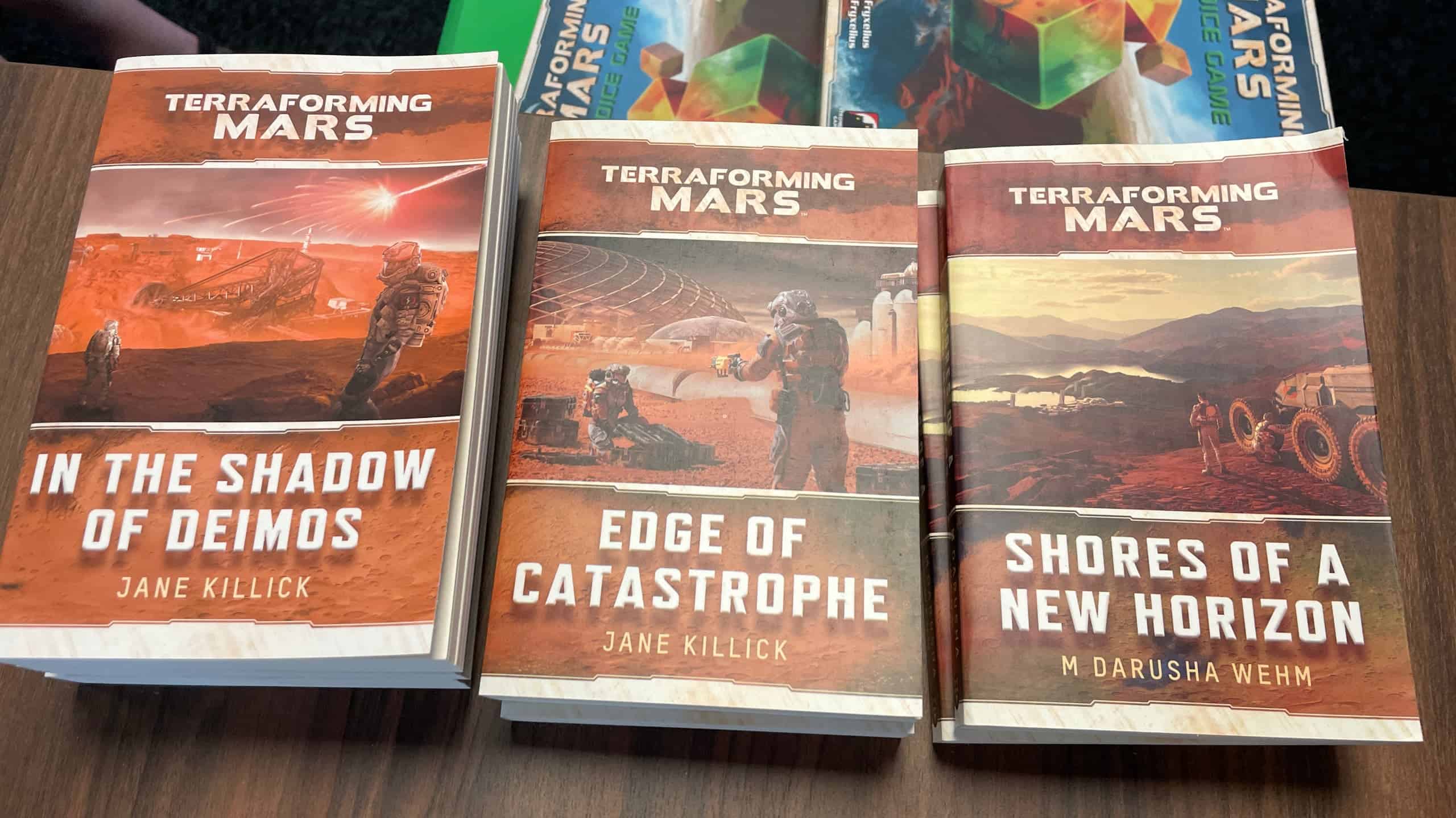Kolme Terraforming Mars -kirjaa: In the Shadows of Deimos, Edge of Catastrophe ja Shores of a New Horizon