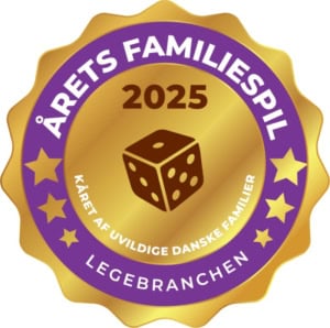 Årets Familiespiel 2025 -logo: kultainen sinetti, jossa violetti rengas ja keskellä noppakuvio.