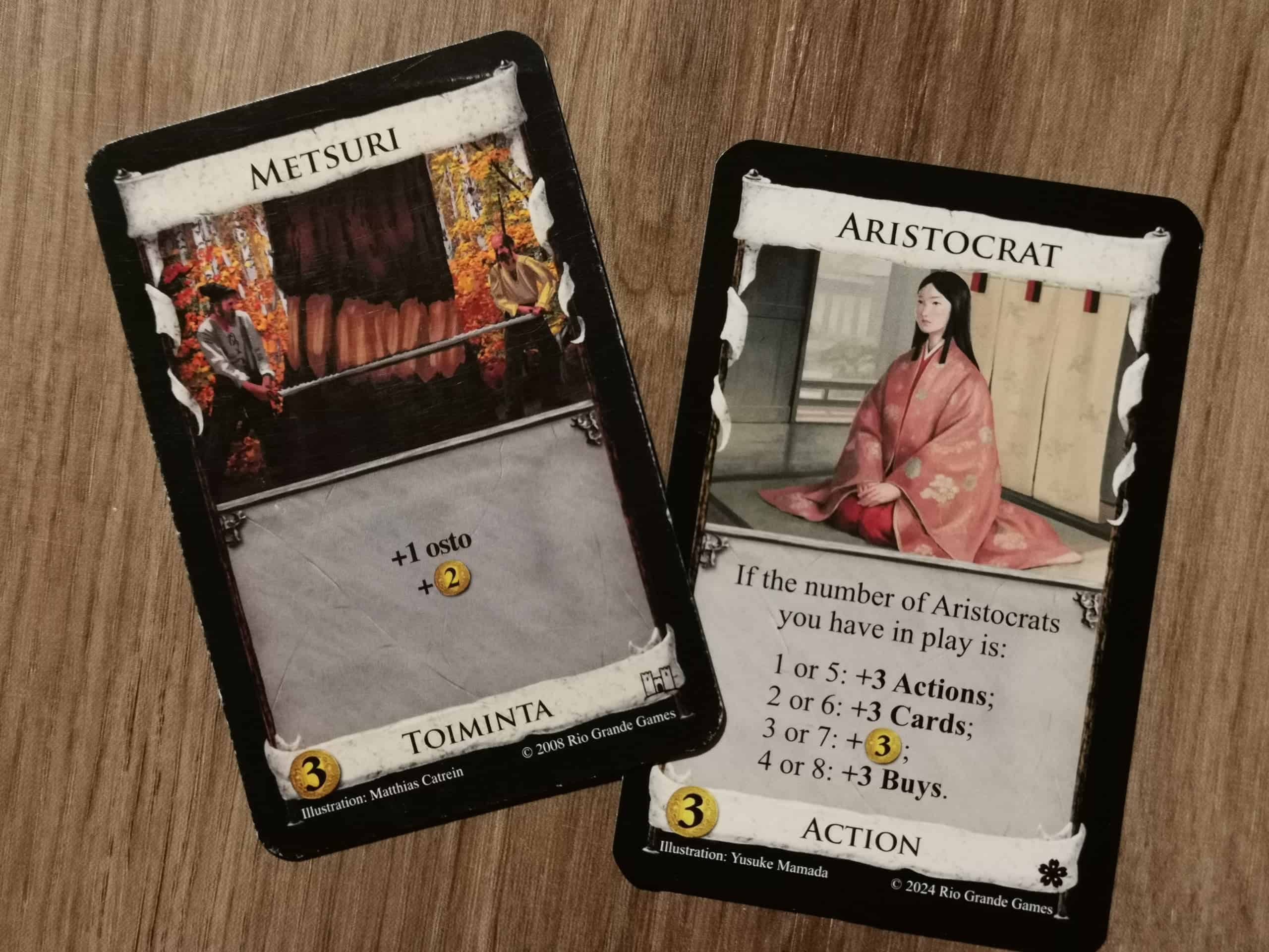 Metsuri- ja Aristokraatti-kortit.